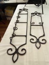 2 METAL WALL SHELVES FOR PLATES OR DECORATIVE ITEMS PICK UP ONLY.