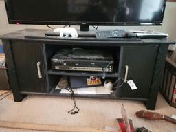 BLACK ENTERTAINMENT CENTER WITH SEIKI 48" TV, NEWSPAPER HOLDERS ON SIDES IN