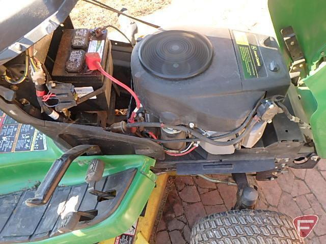 John Deere X320 lawn tractor with 48in mowing deck and blower, 509 hours showing