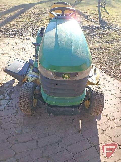 John Deere X320 lawn tractor with 48in mowing deck and blower, 509 hours showing