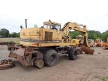 CATERPILLAR 214B-FT RUBBER TIRED EXCAVATOR,  HY-RAIL, WITH MAGNATECH MAGNET