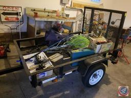 Fabrique Carry On Trailer Corp. 2000 pound hauling trailer with tail gate. Model #GVWR/PNBV. Vin