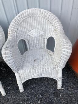 2 matching white wicker chairs