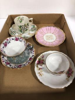 Tea cups and saucers missing one cup