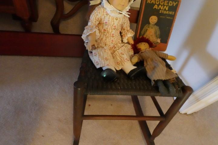 ANTIQUE RUSH BOTTOM ROCKER WITH RAGEDY ANN BOOK AND DOLLS
