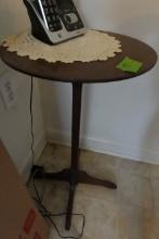 SMALL WALNUT COLOR PLANT STAND APPROX 2 FEET TALL X 12 INCH ACROSS
