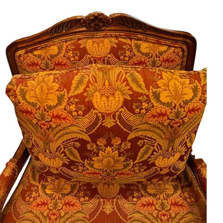Carved Wood and Upholstered Arm Chair -