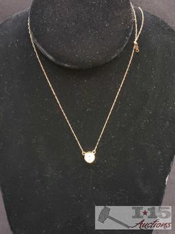 2 10k necklaces 18" long with CZ pendants.