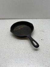 vintage number three cast-iron skillet with smoke ring