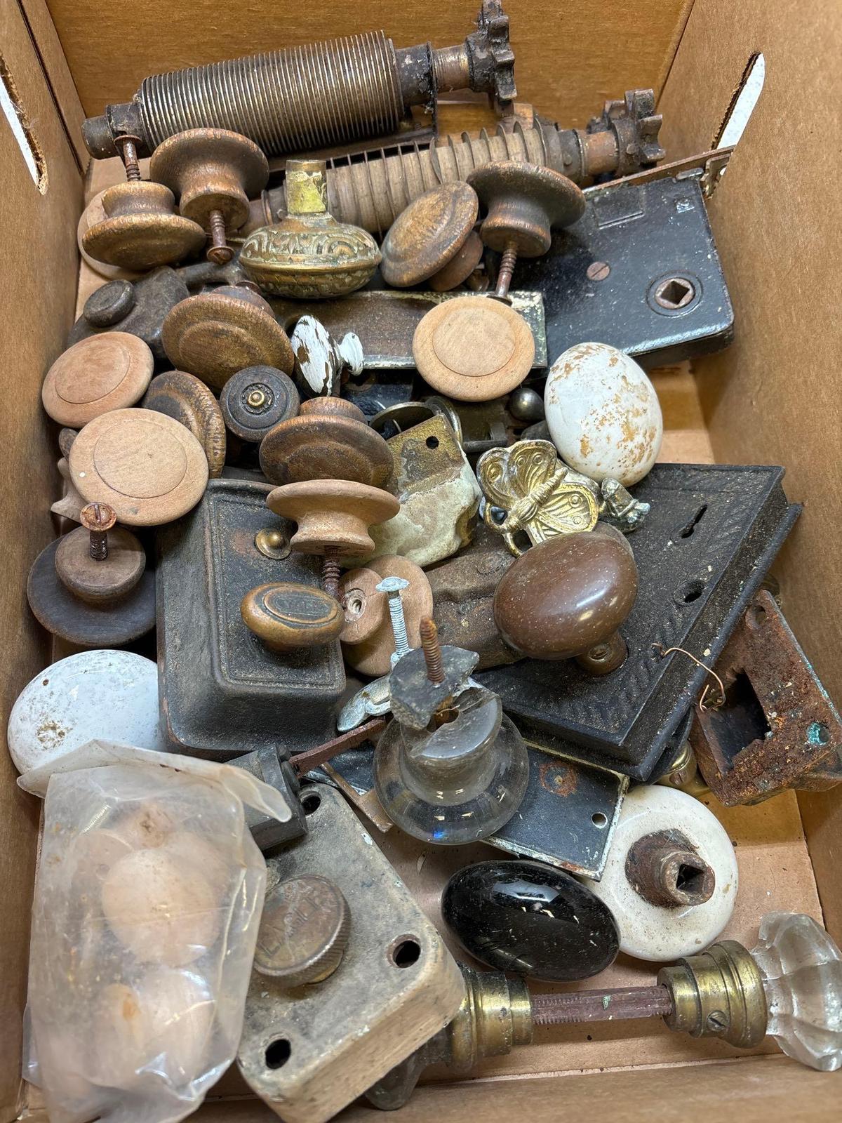 box of antique hardware door knobs lock set etc.