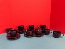 Nice lot of purple fiestaware cups and saucers, cream and sugar