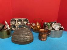 Vintage kitchen items, cookie cutters, molds, copper tea kettle, and more