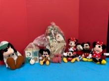 Plush Minnie, Mickey, and goofy dolls