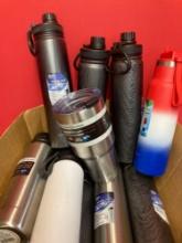 Box full of new stainless steel insulated tumblers, and vacuum bottles