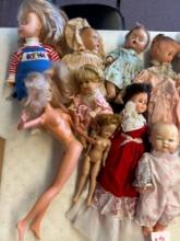 Group of vintage dolls, including Mattel Barbie United plane