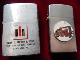 PAIR OF OLD "INTERNATIONAL HARVESTER" ADVERTISING CIGARETTE LIGHTERS-SOME SCRATCHES AND LOOSE LID