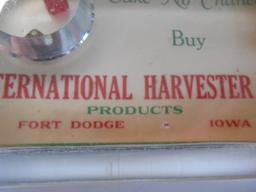 EARLY INTERNATIONAL HARVESTER ADVERTISING PAPER WEIGHT WITH A SMALL PAIR OF DICE-FT. DODGE IOWA