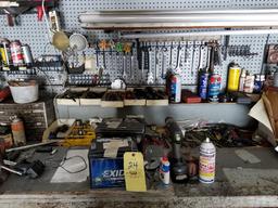 Contents of workbench including wrenches, sockets, hardware, 2 used batteries