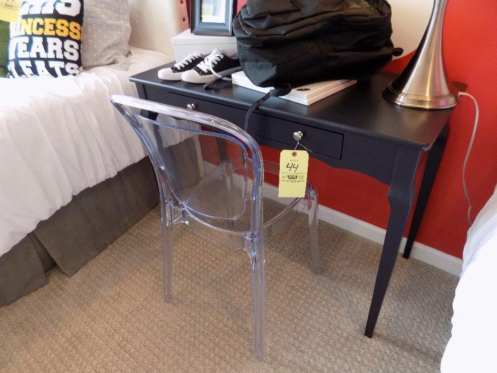 One-drawer desk with clear plastic chair