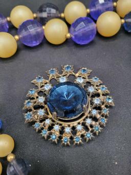 Vintage Jeanne rhinestone brooch and large plastic bead necklace