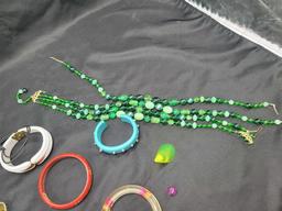 Group of plastic costume jewelry, bangles, damaged necklace with glass beads