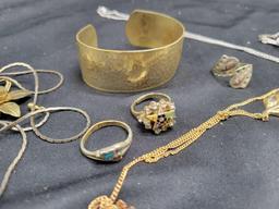 Group of assorted costume jewelry, necklaces, bracelets, rings