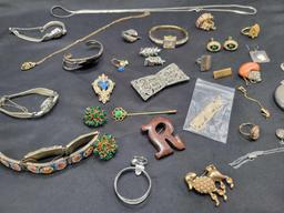 Group of earrings, costume rings and silver tone jewelry