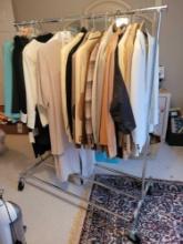Clothing rack on casters with suits and dresses