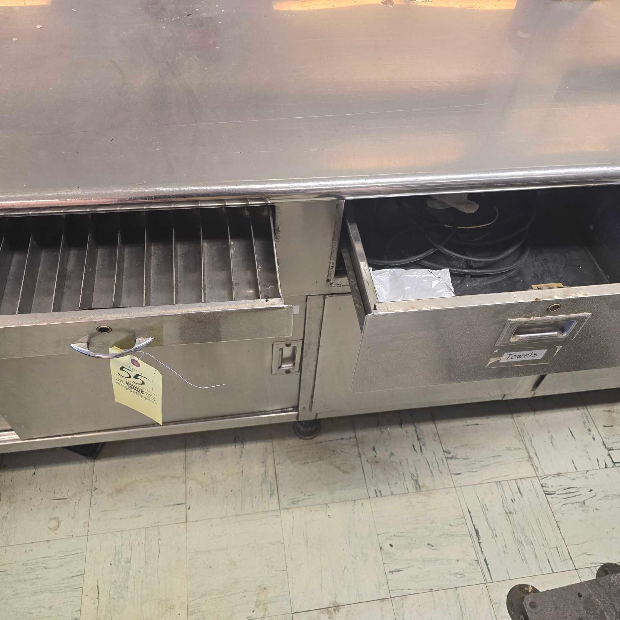 large stainless Steel counter with sink and outlets