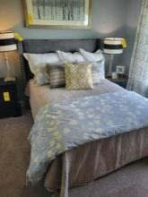 Queen size bed with upholstered headboard and frame, mattress/boxspring and bedding