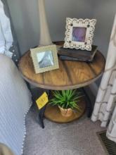 Wood top metal frame side table with frames, books and artificial plant