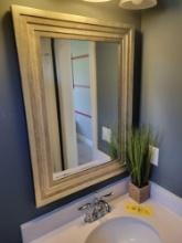 Bathroom mirror, rug, towels, curtain and artificial plant