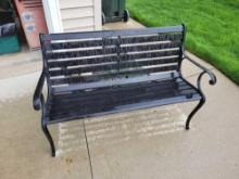 Metal frame with wood slat park bench
