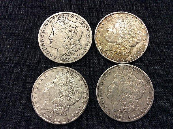 4 U S one dollar coins,years 1890,1880,1886,1884