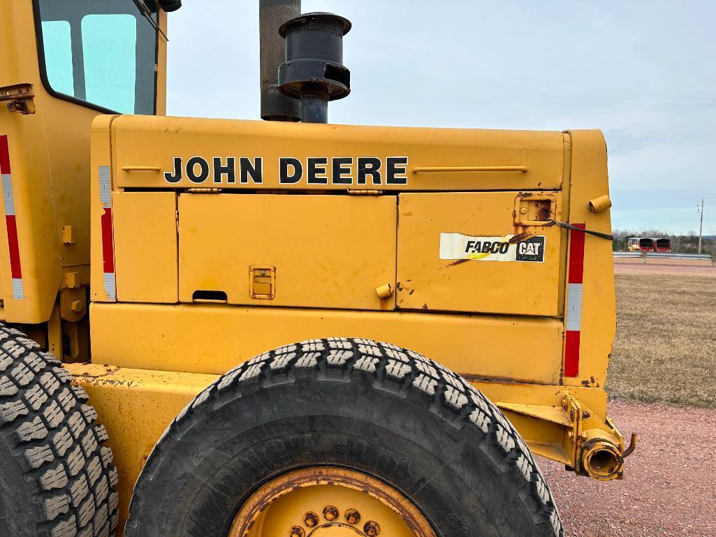 John Deere 670 motor grader, cab w/ heat, 4WD, 12' blade, front blade, 14.00x24 tires, powershift