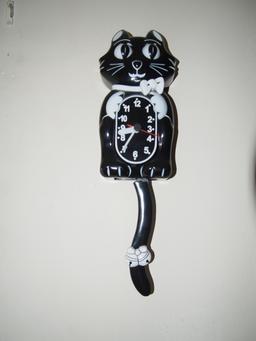 Black cat wall clock