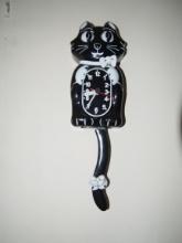 Black cat wall clock