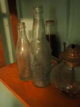 Assorted vintage soda bottles