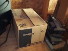 Box of Champion sporting clays and belt sander