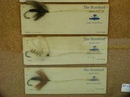 Display of 6 "The Standard" bass fly lures, each different